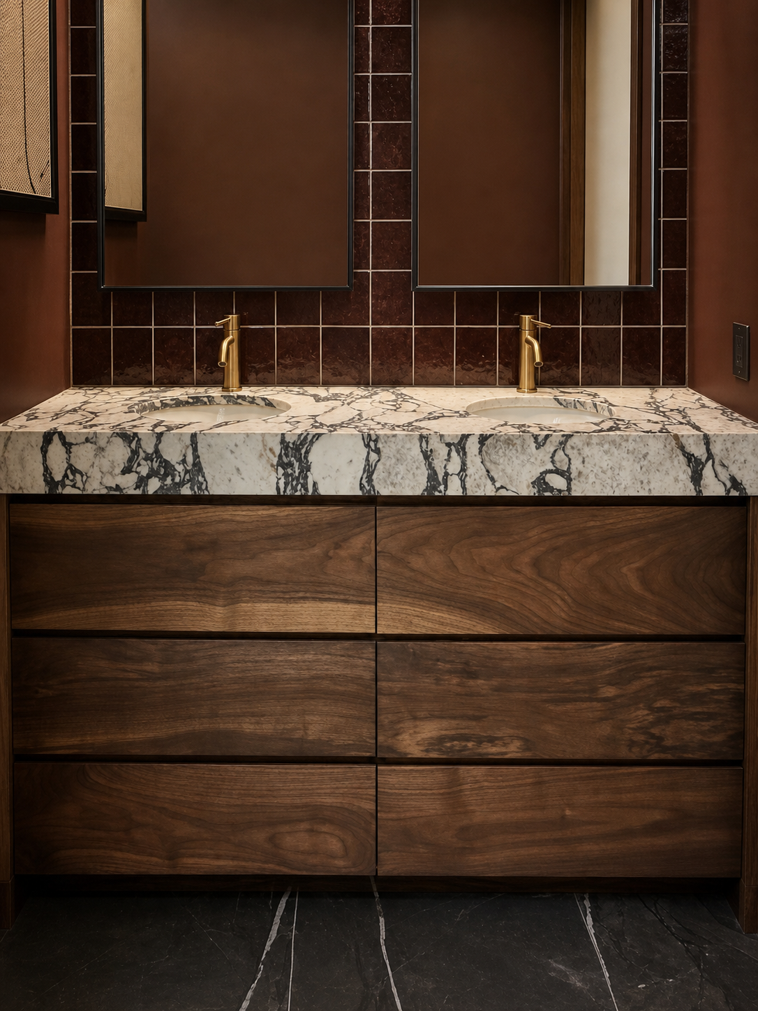 Black walnut vanity drawer fronts, stone top, and brass faucets
