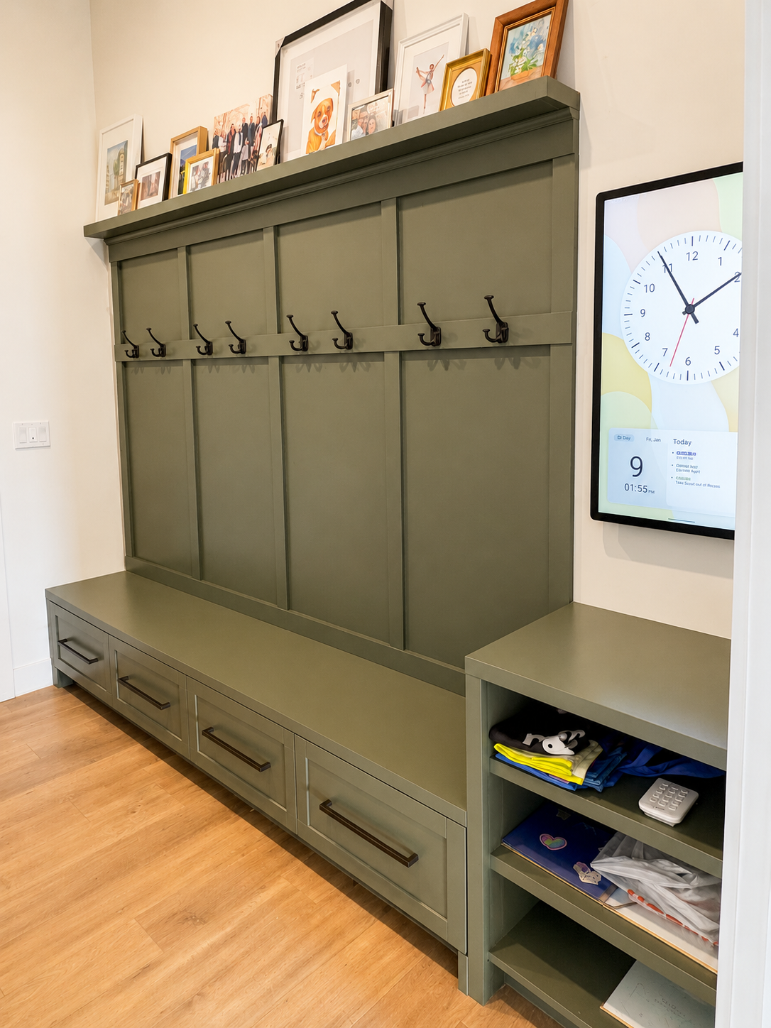 Custom mudroom built-in with bench, drawers, and coat hooks